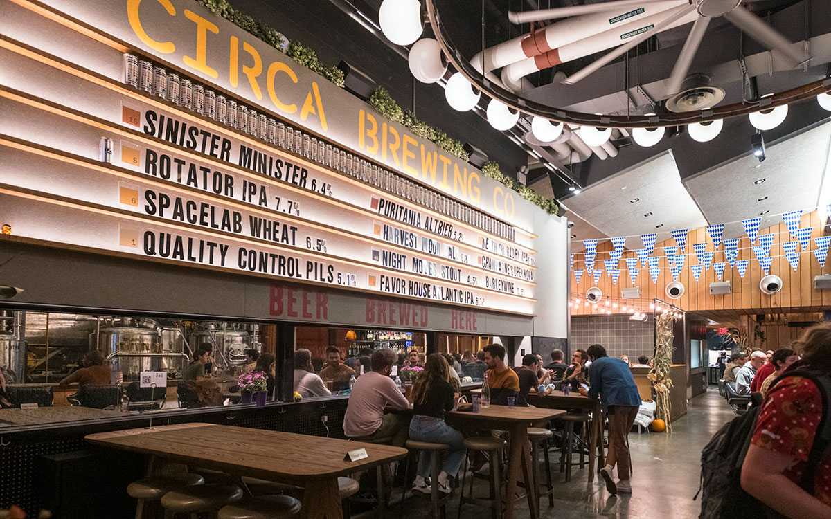 Circa Brewing Company tasting room with groups of people sharing a beer